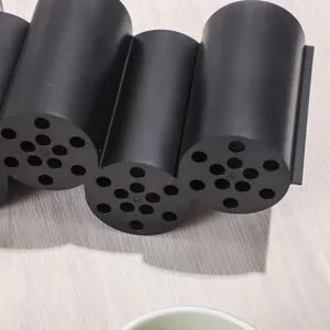 Close-up of black multi-grid plastic chopstick holder and draining storage bucket detail.