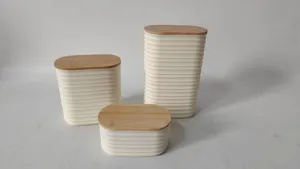 Plastic storage canister detail showing ridged body and natural bamboo lid design.