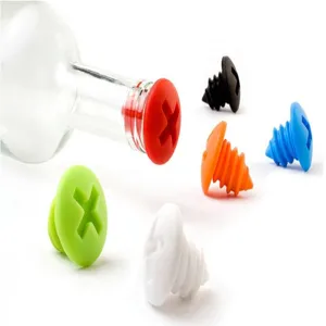 Detail view of colorful silicone screw-shaped wine bottle stoppers, creative kitchen barware tool.