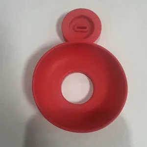 Red silicone ice cream drip protector holder detail view, anti-melt popsicle tray.