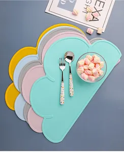 Silicone cloud placemat detail view, cute kids tableware mat in multiple pastel colors.