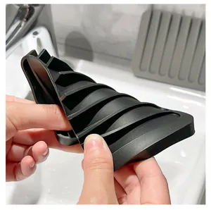 Silicone soap holder detail view, flexible drain mat and anti-slip bathroom tray design.