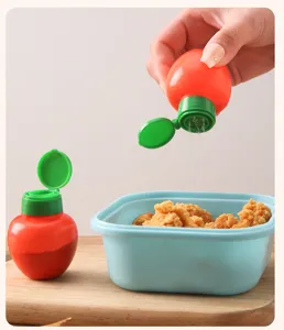 Mini especiero de plástico para sal y pimienta, ideal para cocina y uso portátil.