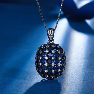 Exquisite black gold plated synthetic sapphire pendant necklace with sparkling pavé cubic zirconia.