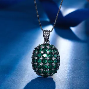 Close-up view of the elegant black gold-plated oval green gemstone pendant sparkling brilliantly.
