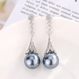 Elegant long silver-tone dangle earrings with sparkling cubic zirconia and dark grey pearls.