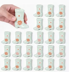 Miniature floral boot shape decorative ornament detail display, cute green plant pot item.