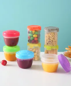 Detail view of mini plastic jam container with secure colorful lids, perfect for picnic snacks.