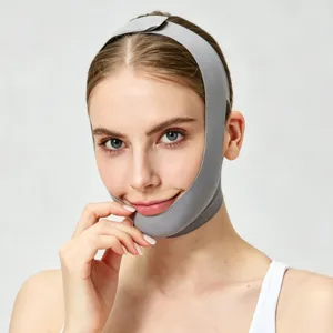 Detail view of the gray breathable V-line face lifting bandage, worn comfortably for chin support.