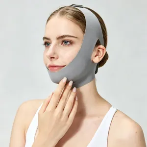 Close-up of gray breathable v-line face lifting bandage showcasing elastic fabric design.