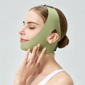 Green V-face lifting bandage detail view, breathable facial shaping tool for contouring.