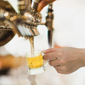 Detailed view of clear mini 30ml glass shot cup, perfect for party drinks and beverage tasting.
