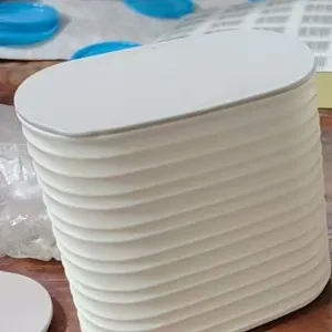White ribbed plastic storage container with lid, modern minimalist desktop organizer jar for home.