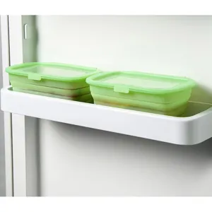 Juego de recipientes de almacenamiento de alimentos de silicona plegables con tapa práctica.