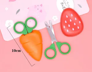 Cute carrot strawberry safety scissors detail view, creative kids craft tool with protective case.