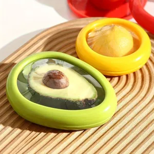 Detail view of silicone fruit storage box, creative avocado and lemon fresh keeper for fridge.