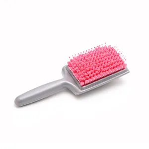 Absorbent quick dry hair brush with pink sponge bristles, ideal for home hair care and scalp massage.
