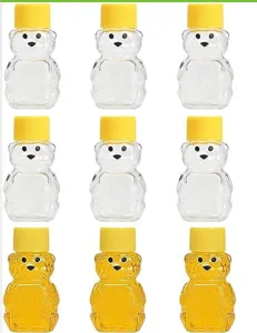 Bottiglie di miele a forma di orsetto in plastica trasparente con tappi gialli, 60ml.