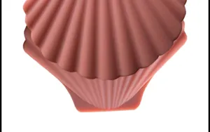 Close-up detail of the creative shell-shaped silicone heat-resistant kitchen pot handle cover.