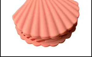 Silicone seashell kitchen pot holder detail, heat resistant anti scald design for cooking pans.