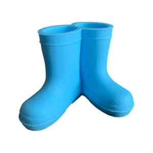 Cute blue rain boot toothbrush holder, creative silicone pen stand for bathroom desktop.
