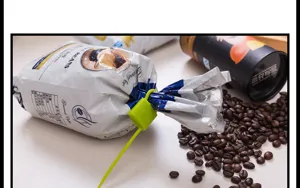 Silicone lock-shaped zip tie in use, flexible bundling rope for food bags and daily storage.