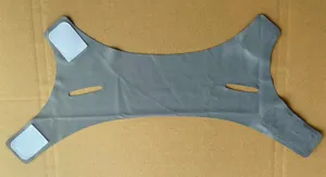 Detail view of grey breathable v-face lifting bandage with velcro straps for facial contouring
