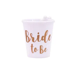 White bride to be bachelorette party plastic shot glass with shiny gold lettering cup.