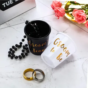 Bachelor party shot glass set black and white groom to be cup with beads and rings.
