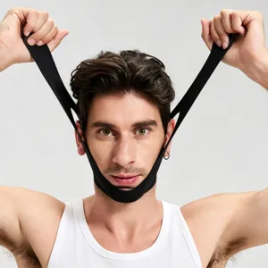 Detail view of the black face lifting bandage showing adjustable straps and fabric fit.