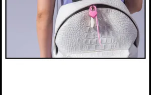 Detail view of the pink lock-shaped silicone cable tie and storage binder for daily use.
