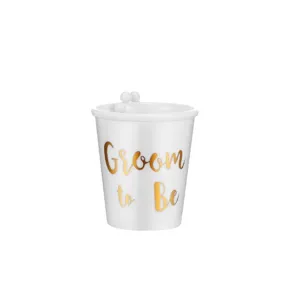 White bachelor party cup with gold groom to be text and pearl decor for wedding celebration events