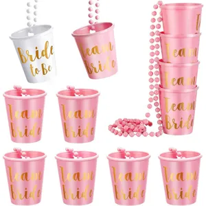 Bachelorette party pink white shot glass necklace set detail view, bride team cups