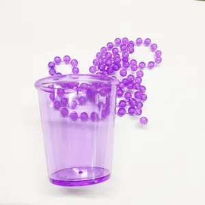 Purple plastic shot glass with bead necklace, ideal for bachelor and bachelorette parties.