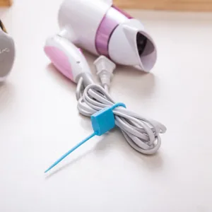 Multifunctional lock-shaped silicone cable tie for bundling and organizing cords easily.