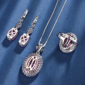 Detailed shot of exquisite pink gemstone jewelry set including necklace, earrings and ring.