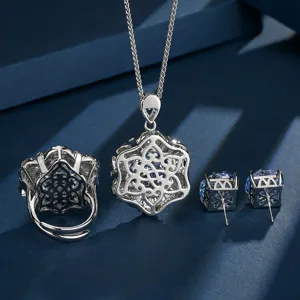 Exquisite silver jewelry set featuring gradient blue gemstone pendant necklace ring and earrings.