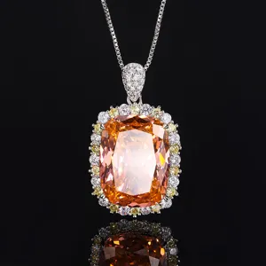 Prachtige oranje edelsteen hangketting met schitterende halo stenen voor elegante dames.