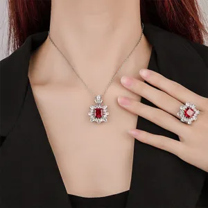 Elegante set collana e anello con pietra rossa quadrata e cristalli di zircone scintillanti.