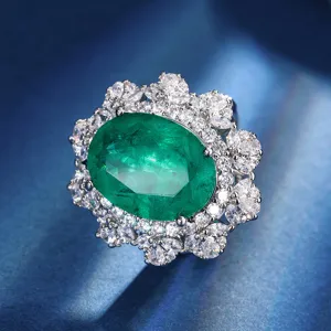 Exquisite oval green gemstone cluster pendant necklace with sparkling white cubic zirconia.
