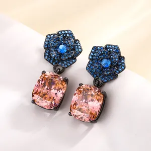 Vintage black gold plated drop earrings featuring blue floral zirconia and pink cushion stones.