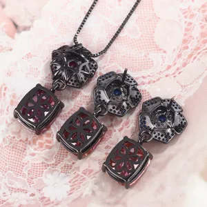 Black gold vintage style jewelry set necklace and earrings with colorful stones and clover design.
