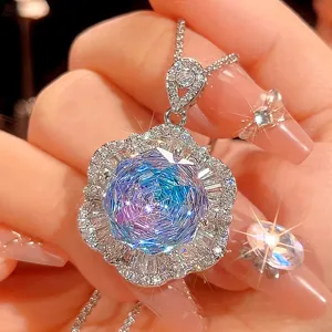 Close-up detail of the stunning gradient crystal flower pendant necklace with shimmering stones.