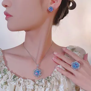 Close-up detail of women's luxury gradient jewelry set, elegant crystal floral necklace ring.