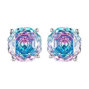 Close-up detail of millennium cut iridescent gradient crystal stud earrings with four-prong setting.