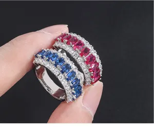 Close-up detail of vintage style colorful gemstone and cubic zirconia pave rings for women.