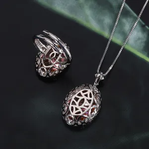Vista dettagliata del set di gioielli in argento nido d'uccello con collana e anello padparadscha.