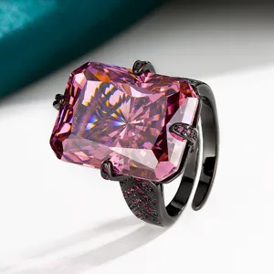 Exquisite radiant cut pink crystal ring with black plated band and dazzling pavé accent stones.