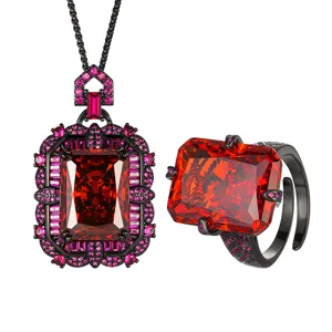 Close-up detail of the luxury red radiant cut gemstone jewelry set in black gold.