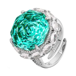 Stunning detailed close-up of a luxury green gemstone cocktail ring with sparkling pave zirconia.